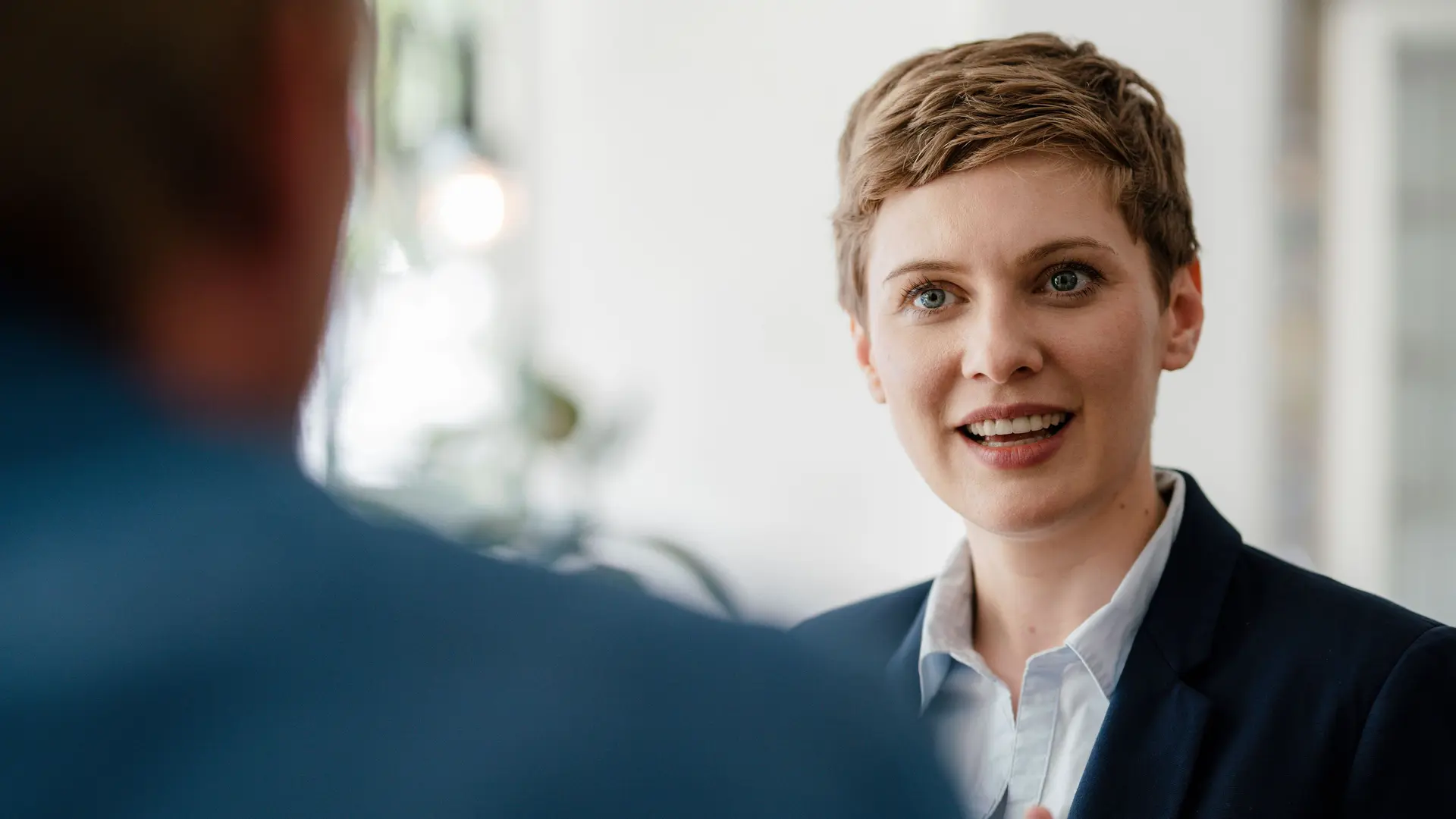 Financial advisor meeting with client in modern office